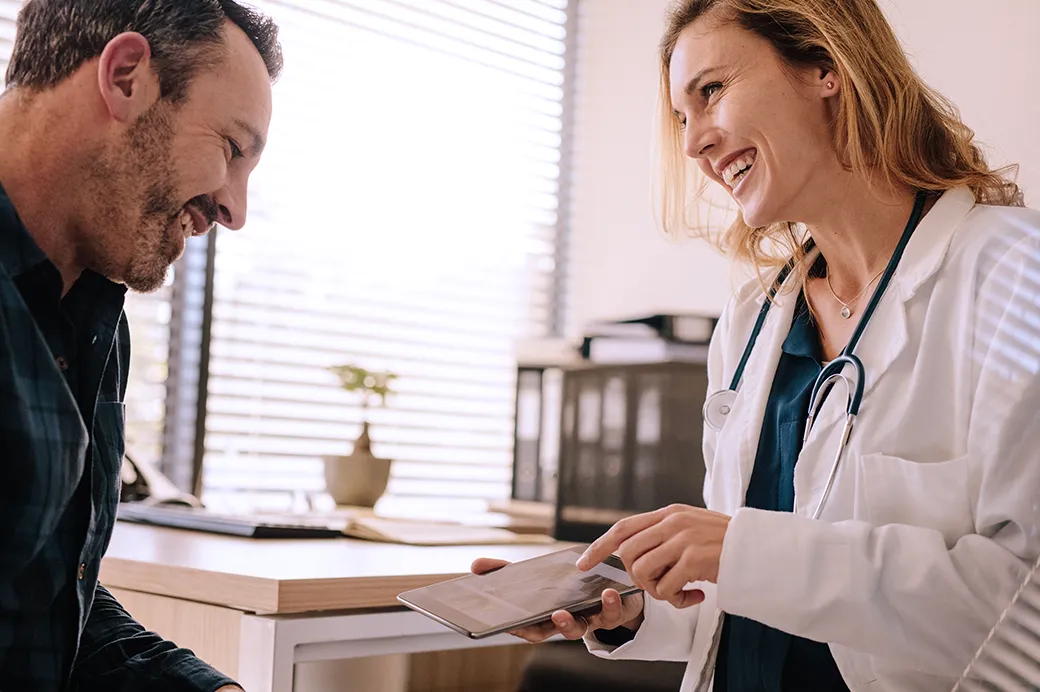 Doctor showing patient tablet